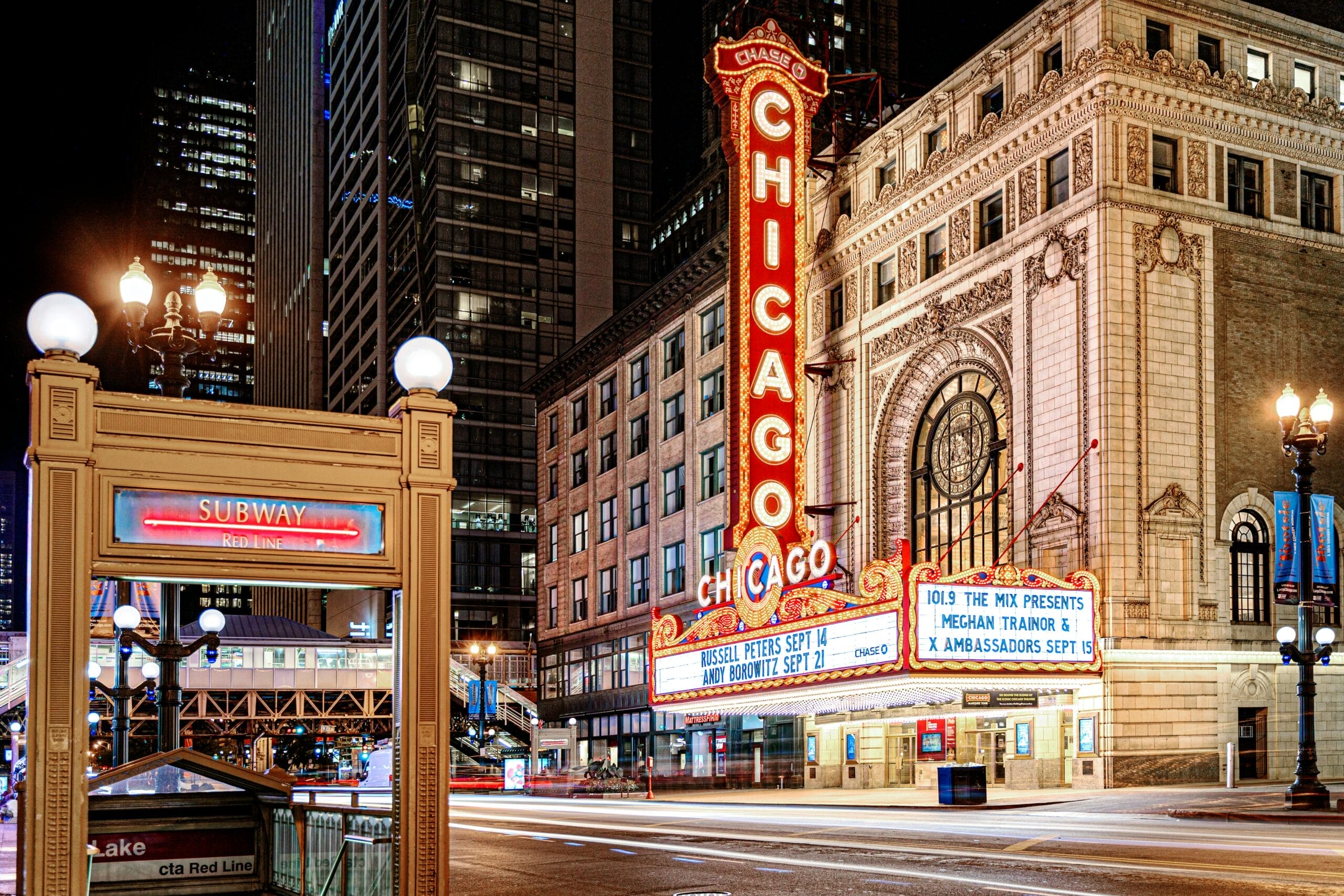 The famous Chicago theater shot with a long exposure at night, right across the street from the redline subway stop depicting the new Chicago way to invest early and often to benefit from compound interest.