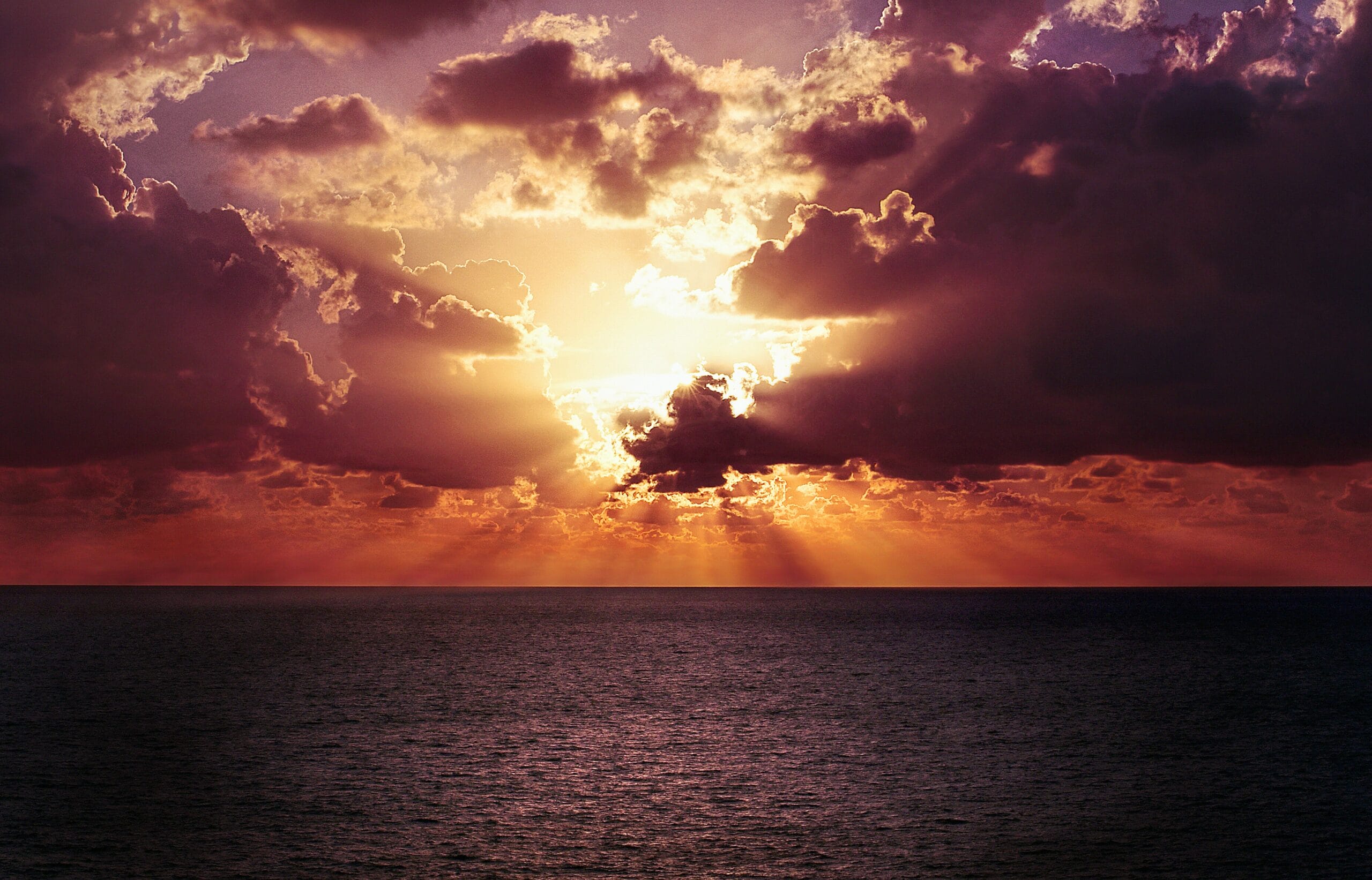 Evening clouds over the sea representing things we can't control, like inflation.